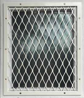 Security mesh grille in london, fitted externally to protect window glass.